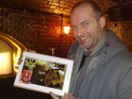 Oliver Gray signs a photograph